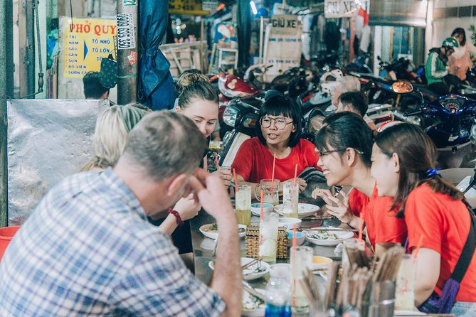 12 Tasting Street Food & Sightseeing By Scooter with Student - Walking through Ho Thi Ky Flower Market