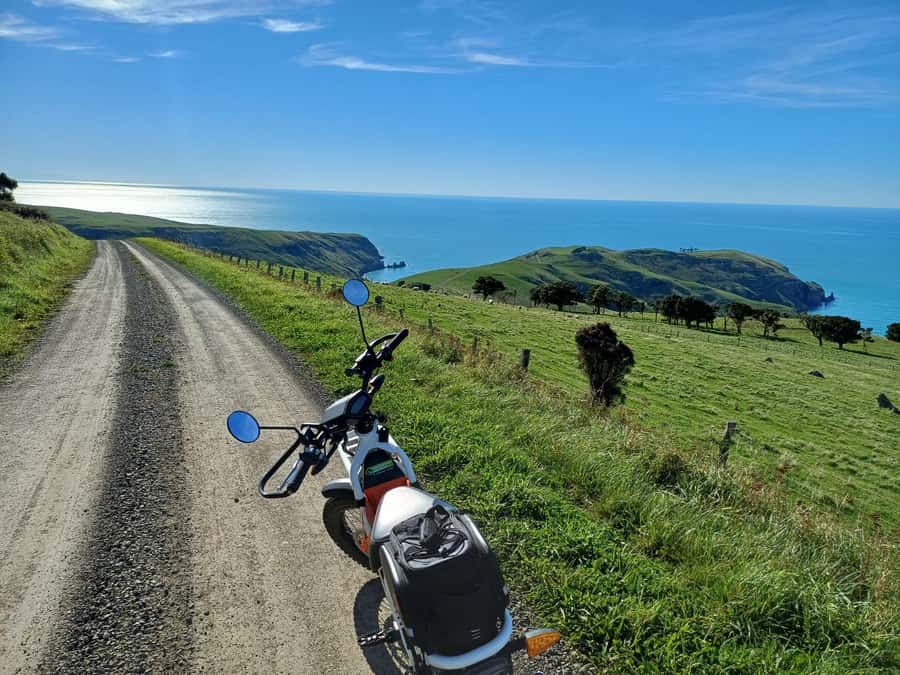 Akaroa: Lonely Beach Trail by E-Scooter. selfguided day out - Hinewai Reserve and the walk to Stoney Bay Peak