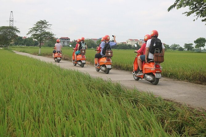 Beautiful Female Riders Vespa Red River Countryside Tour 5 Hours - A Fruit Farm in the Rice Fields