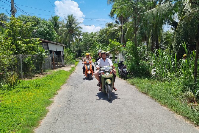 Ben Tre Mekong Zig Zag: Scooter, Sailboat, and Food (Full day) - Sailing a quiet Mekong tributary