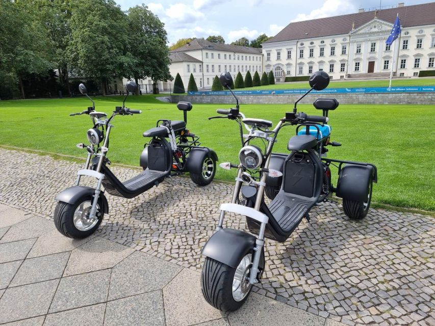 Berlin: 3-Hour Guided Small Group Fat Tire E-Scooter Tour - Crossing Berlin’s former divide at Checkpoint Charlie