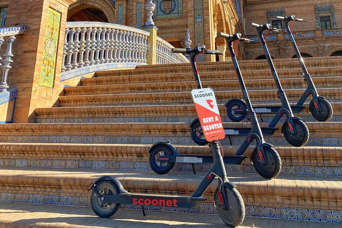Electric Scooter Rental Seville - Along the river to Torre de Oro