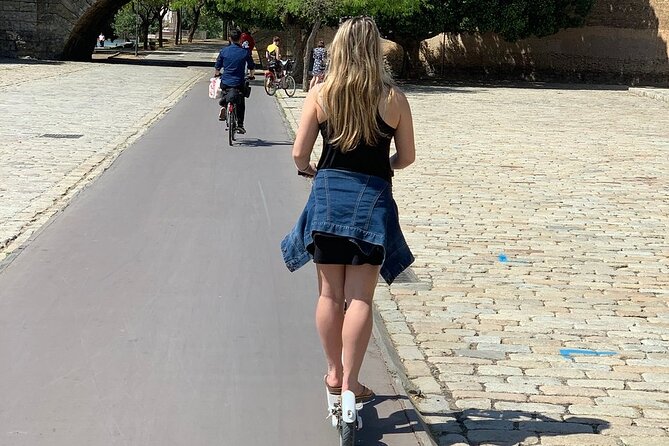Electric Scooter Rental Seville - Crossing Triana Bridge into the district of Triana