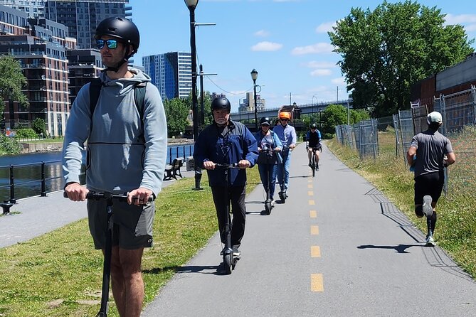 Experience Old Montreal on e-scooters with a local comedian - The Lachine Canal and its historic setting