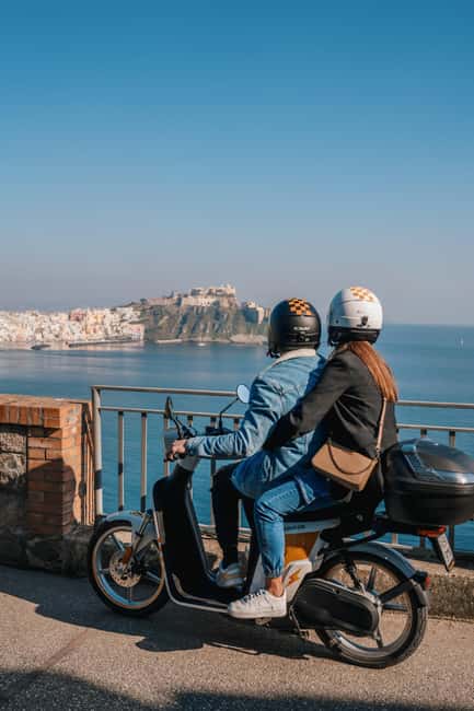 Explore Procida on an Electric Scooter: Daily Rental with All the Perks - Riding Procida’s roads with one or two people