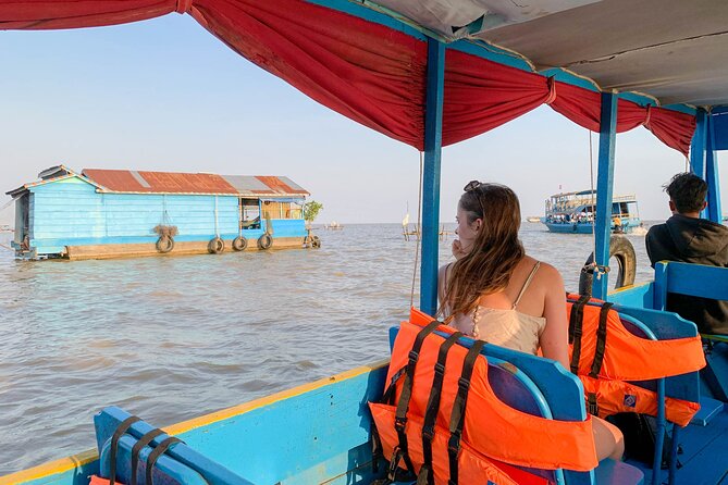 Floating Village Sunset Boat Vespa Tour / Tuk Tuk Available - Sunset on Tonle Sap with a cold drink