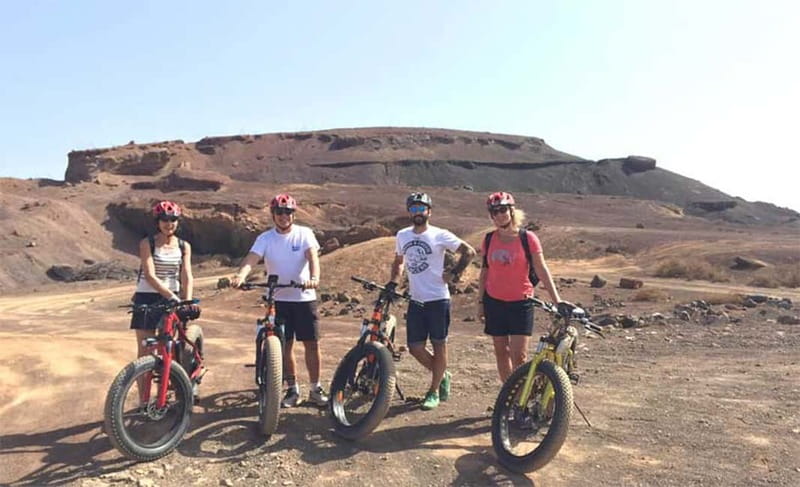 From Corralejo: Fuerteventura Guided E-Bike/E-scooter Tour - A café pause near Lajares