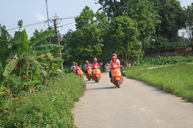 Hanoi Vespa Full Day City & Countryside with Female Ao Dai Riders - Railway life near Duờng Tau