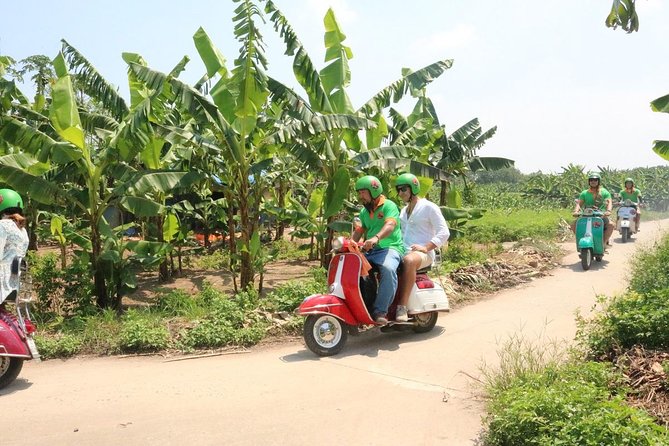 Hanoi Vespa Tour Explore Red River Delta & Rural Villages 5 Hours - Leaving Hanoi through back streets