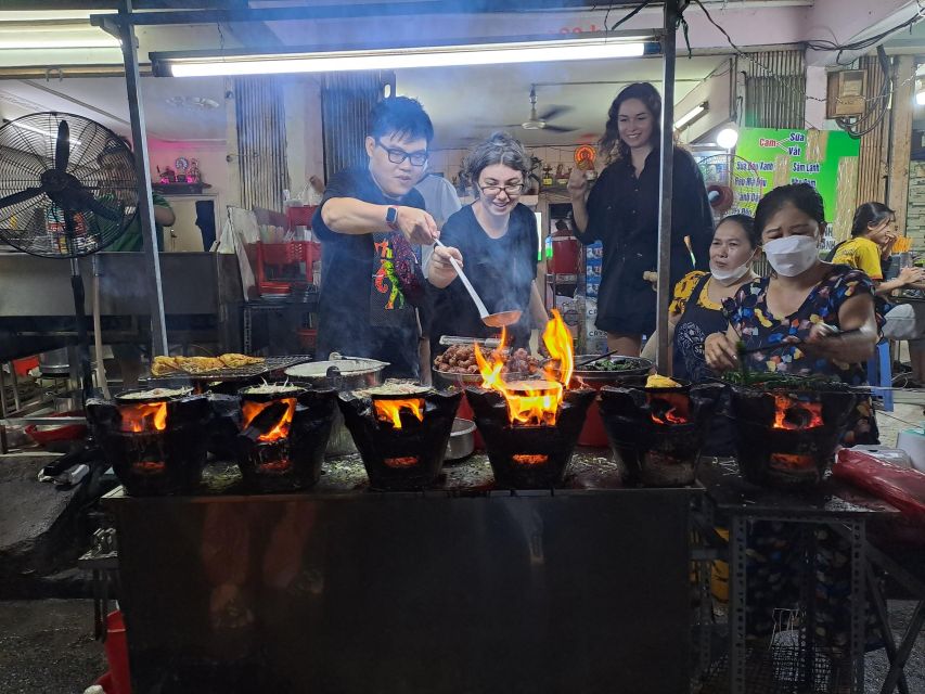 Ho Chi Minh City: Food Tour by Scooter with Eleven Tastings - District 10 brings crispy snacks and fried bao