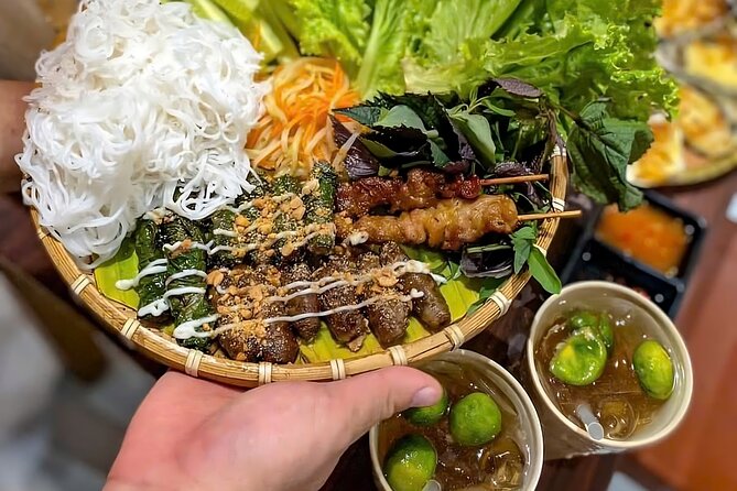 Nha Trang Local Food Tasting and Sightseeing Tour By Scooter - Grilled beef wrapped in betel leaves at Ngô Sĩ Liên
