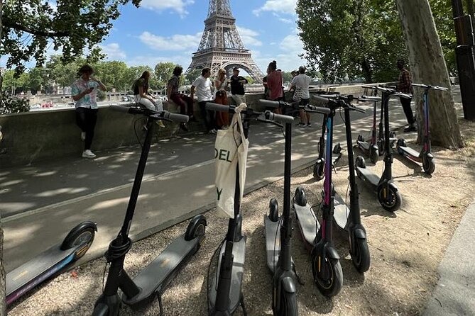 Paris City Tour by E-Scooter with Fun Guide (Small groups) - Standing beneath the Arc de Triomphe