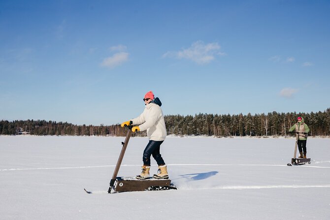 Private Driving Snow Scooters Experience in Finland - A quiet Finnish winter ride with a bit of adventure