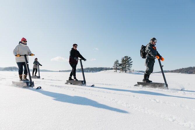 Private Driving Snow Scooters Experience in Finland - From Puumala into the Taiga forest