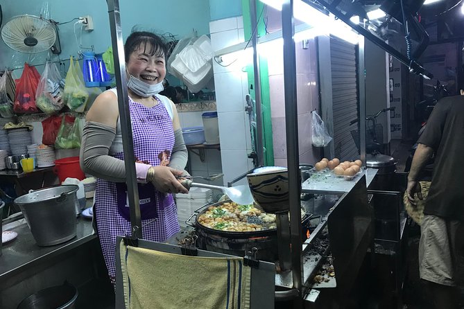 Private Saigon Night Food Tour by Scooter - The first stop: bot chien, dumplings, and a local alley eatery