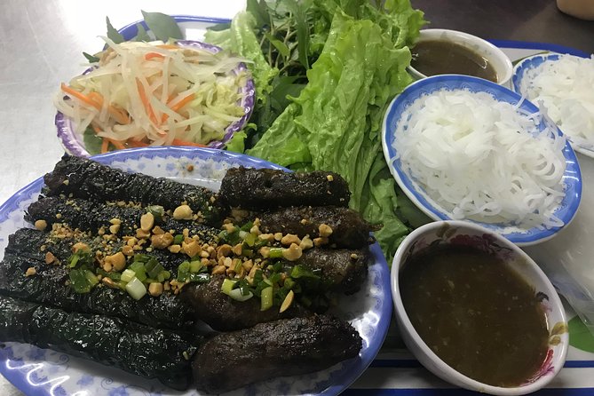 Private Saigon Night Food Tour by Scooter - Ngo Gia Tu connects old apartments with dessert