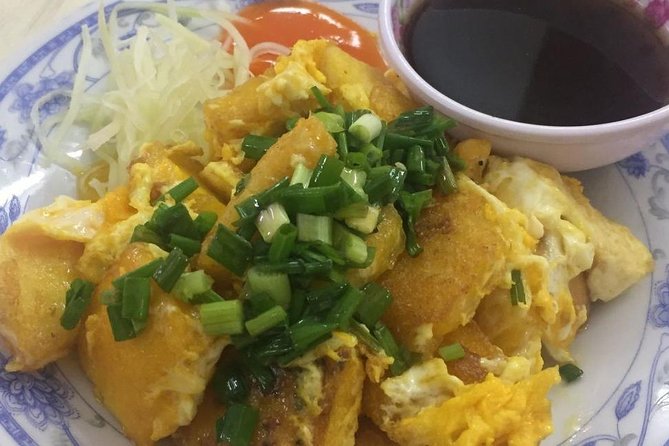 Private Saigon Night Food Tour by Scooter - Stop two brings a bowl of Vietnamese noodle soup