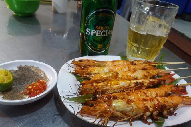 Saigon After Dark and Street Food by Motorbike and Scooter - District 4 barbecue and seafood dinner