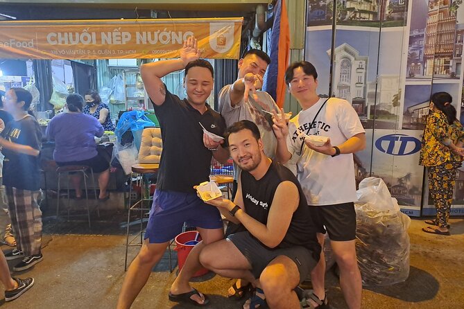 Saigon Food Tour by Scooter with Eleven Tastings - Old apartment buildings and a bowl of bún bò Huế