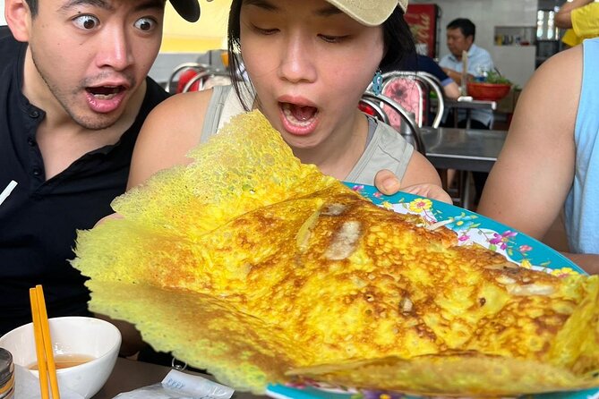 Saigon Food Tour by Scooter with Eleven Tastings - District 3 begins with grilled banana sticky rice