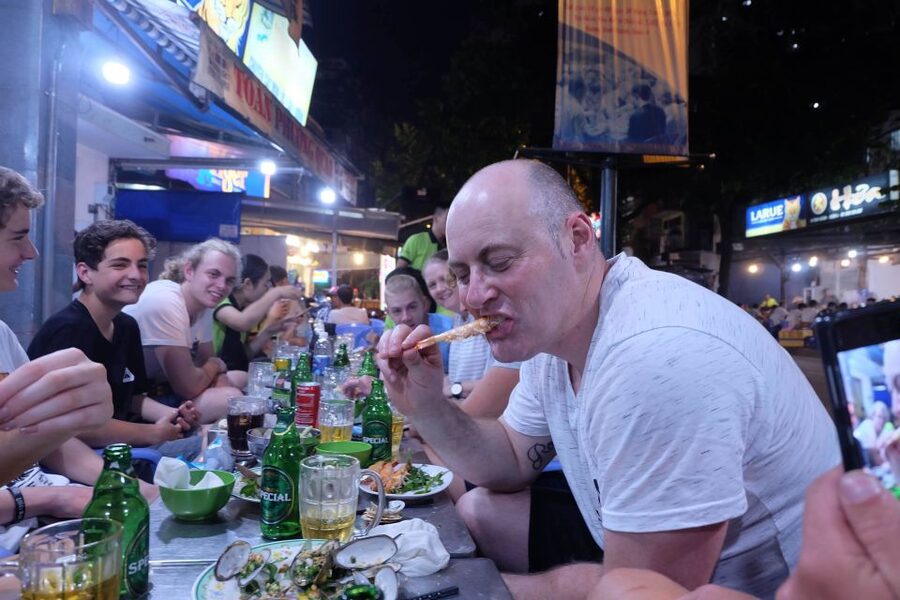 Saigon: Night Sightseeing And Street Food Tour By Vespa - District 4 for a crisp, loaded banh mi