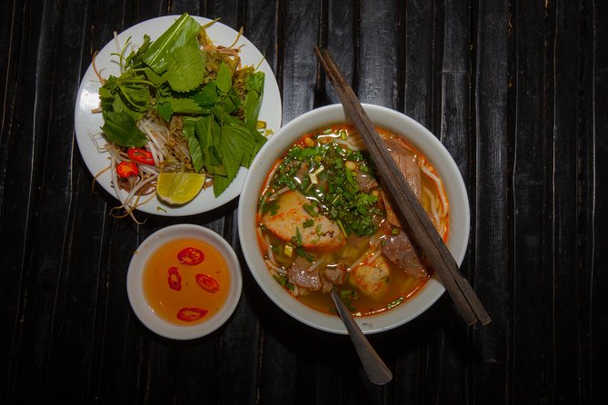 Saigon Night Street Food and City Tour on Scooter - A short nighttime ride becomes part of the sightseeing