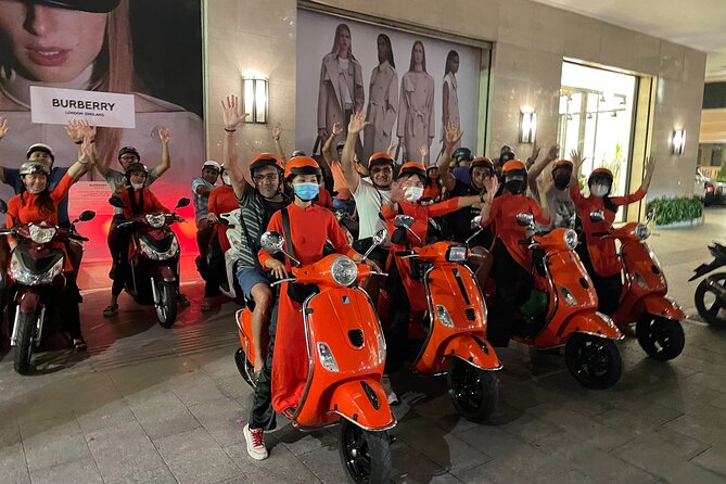 Saigon Vespa By Night Street Food With Female Riders Ao Dai - Seafood and local drinks at the first stop