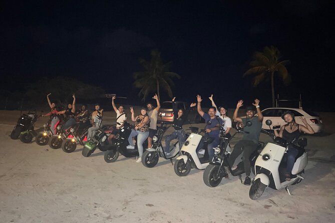 Sunset Island Tour in Aruba on Electric Scooter (1 or 2-seater) - Palm Beach shows Aruba after sunset begins