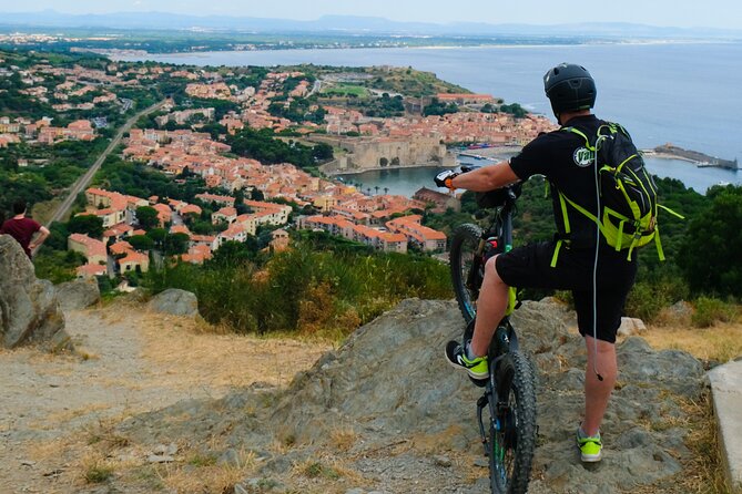 The Collioure Tops on Electric Scooters - The bay, bell tower, and lighthouse