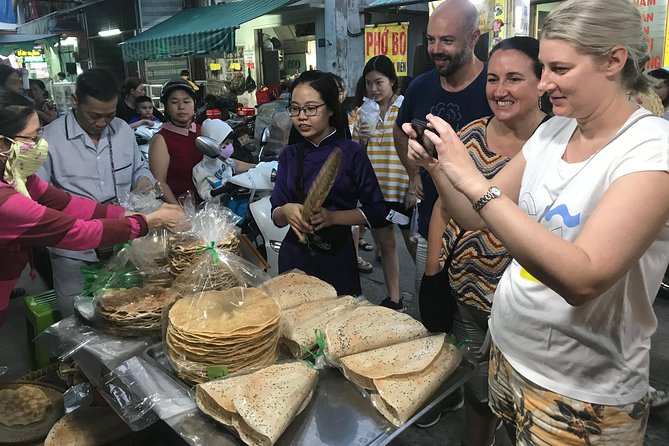 The Unique Ao Dai Street Food Tour By Scooter - Bun bo Hue inside an old apartment building