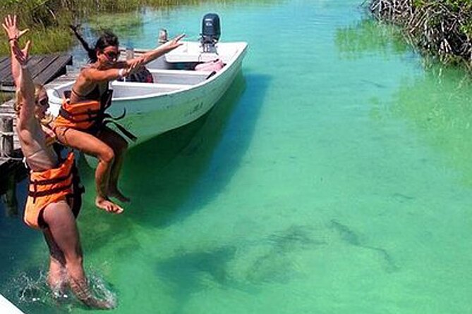 Tulum Guided ATV/Scooter, Muyil Ruins, Boat Eco, Float Down Mayan Canals + Lunch - Exploring Muyil among the reserve’s trees
