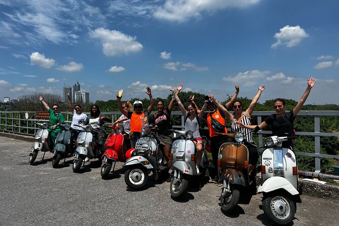 Vespa Tour HANOI BACK STREETS: FOOD+LOCAL LIFE+CULTURE & FUN - Mosaic walls, West Lake, and the B-52 lake