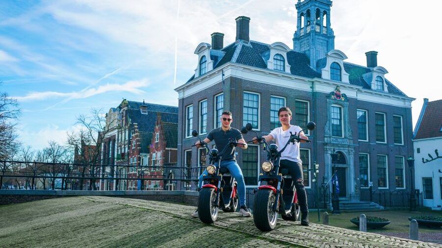 Volendam: E-Scooter Rental - Monnickendam: old houses, harbor terraces, and beer